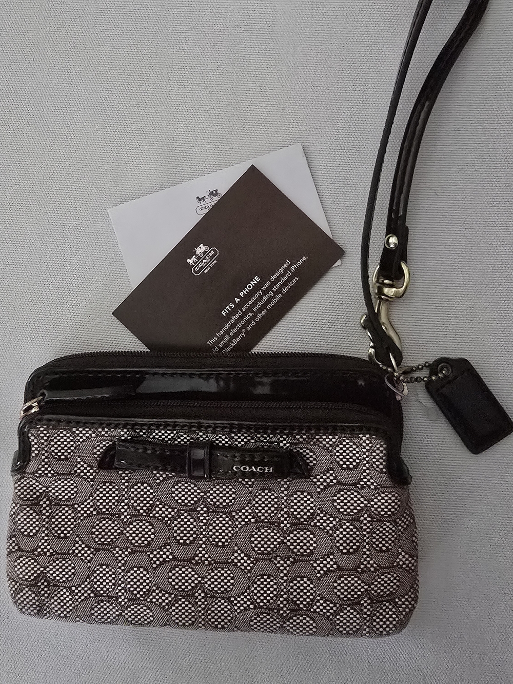 COACH Brown and Black Signature Wristlet Clutch